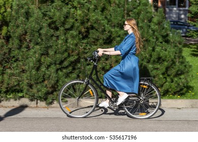 Beautiful Young Woman And Vintage Bicycle, Summer. Red Hair Girl Riding The Old Black Retro Bike Outside In The Park. Having Fun In The City