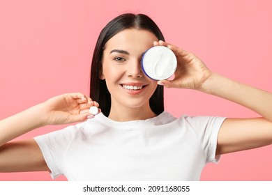 Beautiful Young Woman With Vitamin And Facial Cream On Color Background