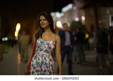 Beautiful Young Woman Is Walking In The Night City.