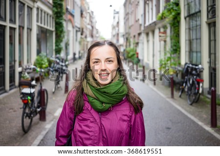 Beautiful young woman walking on the streets of Amsterdam