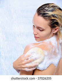 Beautiful Young Woman Washing Her Body Under The Streams Of Water