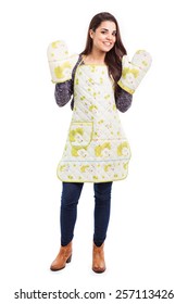 Beautiful Young Woman Wearing An Apron And Some Oven Mitts