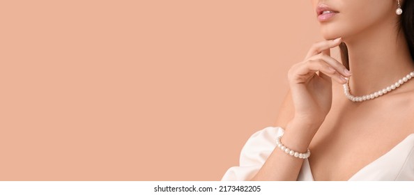 Beautiful young woman wearing stylish jewelry on beige background with space for text - Powered by Shutterstock