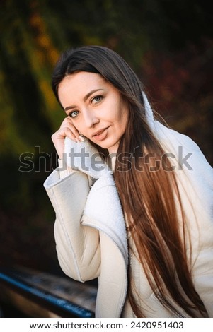 Similar – Image, Stock Photo smiling young woman leaning against a wall