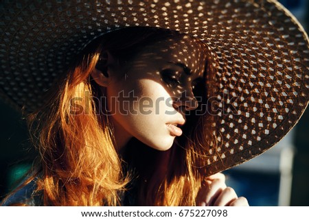 Similar – Young redhead woman covering from sun