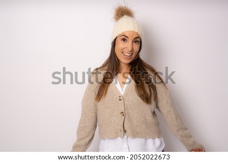 Beautiful young woman winter portrait. Smiling woman wearing warm clothes