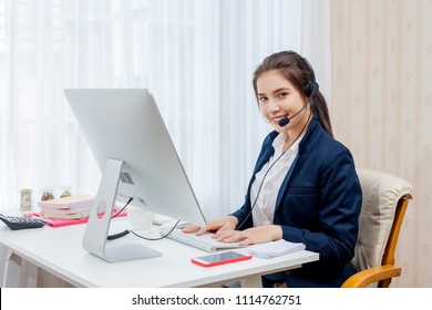 Beautiful young woman working in call centre.