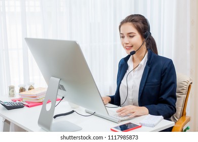 Beautiful young woman working in call centre.
