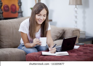 Beautiful Young Woman Working From Home