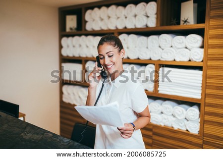 Similar – Image, Stock Photo departed I The hotel key with pendant and the number 7 lies on an unmade white covered bed