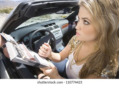 Beautiful Young Woman Writing On Traffic Ticket