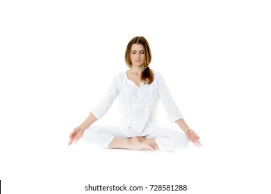 Beautiful Young Woman In Yoga Pose In White Clothes Isolated On White Background. Close Eyes.