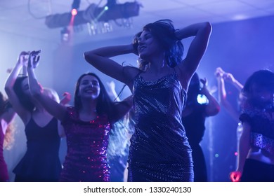 Beautiful Young Women Dancing In Night Club