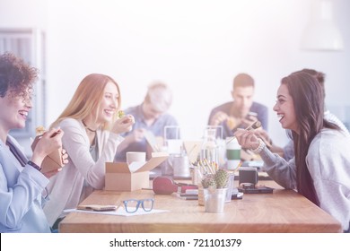 Beautiful Young Women Having Lunch Break At An Advert Agency Office