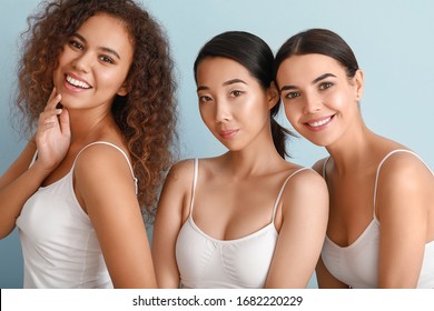 Beautiful Young Women With Healthy Skin On Color Background