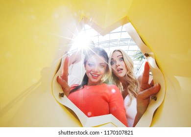 Beautiful Young Women Looking Inside Bag