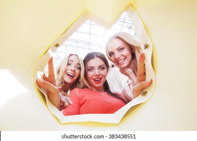 Beautiful Young Women Looking Inside Bag