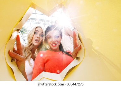 Beautiful Young Women Looking Inside Bag