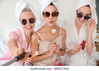 Beautiful young women taking selfie at pamper party