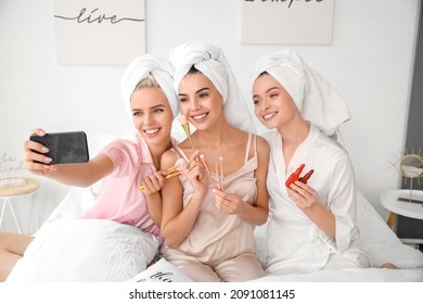 Beautiful young women taking selfie at pamper party