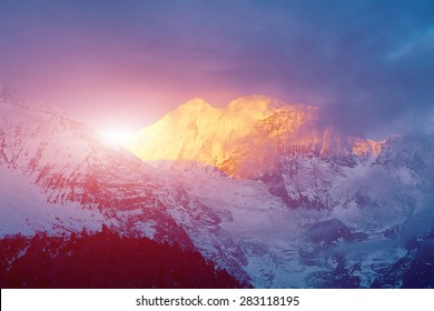 Beautifull Cloudy Sunset In The Mountains With Snow Ridge. Annapurna Region, Himalayas, Nepal.