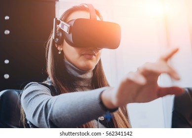 The Beautifull Girl Wearing Virtual Reality Goggles At The Office