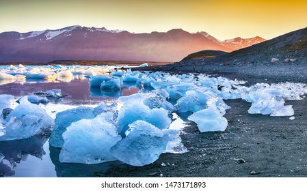 Beautifull landscape with floating icebergs in Jokulsarlon glacier lagoon at sunset. Location: Jokulsarlon glacial lagoon, Vatnajokull National Park, south Iceland, Europe - Powered by Shutterstock