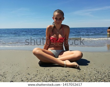 Similar – Young woman and Labrador at the Baltic Sea beach