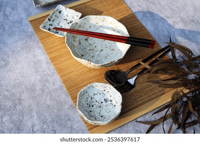 A beautifully arranged assortment of Japanese dishes on the table, showcasing traditional cuisine with a variety of flavors and textures. Perfect for visuals highlighting Japanese culinary art. - Powered by Shutterstock