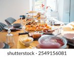 Beautifully arranged brunch table with diverse savory and sweet dishes, bathed in warm sunlight. Perfect for dining, home gatherings, and culinary inspirations.