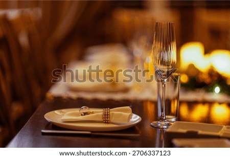 Beautifully arranged dining table features white plates, elegant glassware, and decorative napkins, enhancing the ambiance for a memorable dining experience