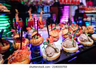 Beautifully Decorated Catering Banquet Table With Different Food Snacks And Appetizers With Sandwich, On Corporate Christmas Party Event Or Wedding Celebration