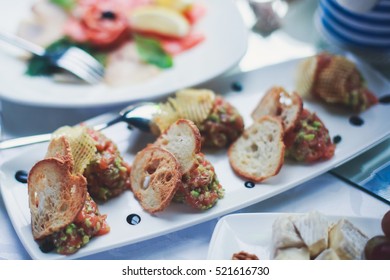 Beautifully Decorated Catering Banquet Table With Oysters, Mussels And Seafood With Ice And Lemon On Corporate Christmas Birthday Party Event Or Wedding Celebration
