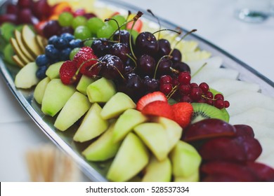 Beautifully Decorated Catering Banquet Table With Different Food Snacks And Appetizers On Corporate Christmas Birthday Party Event Or Wedding Celebration
