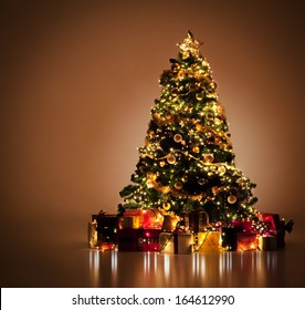 Beautifully decorated Christmas tree with many presents under it.