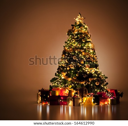 Beautifully decorated Christmas tree with many presents under it.