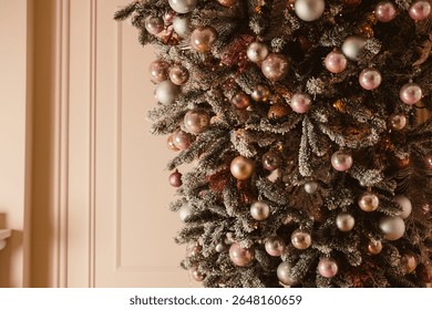 A beautifully decorated Christmas tree with pastel and metallic ornaments, creating a cozy and festive atmosphere for holiday celebrations with family and friends