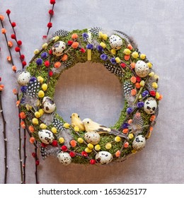 Beautifully decorated Easter wreath on a light background