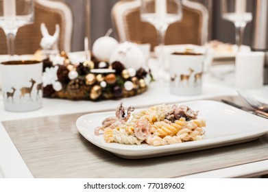 Beautifully Decorated Table With Christmas Decoration. At Dinner, Pasta With Seafood