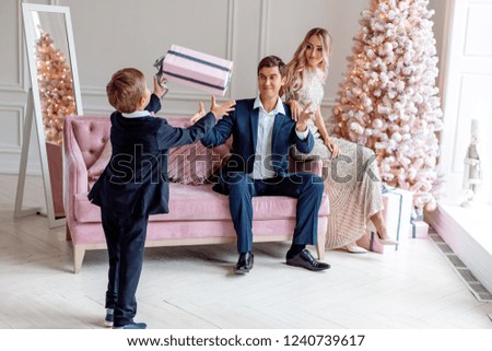 Beautifully dressed family in a Christmas interior. Christmas party