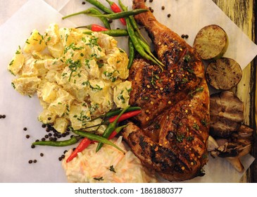 Beautifully Grilled BBQ Chicken With Sides Of Potato Salad And Coleslaw With Roasted Garlic, Lime  And Fresh Chillies 