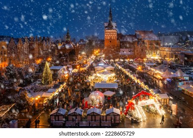 Beautifully lit Christmas market in the Main City of Gdansk during a snowfall. Poland - Powered by Shutterstock