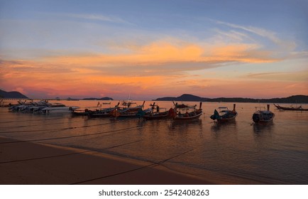 A beautifully serene view of a stunning sunset with fishing boats - Powered by Shutterstock