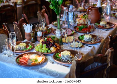 Beautifully served banquet table with cold snacks. wedding reception