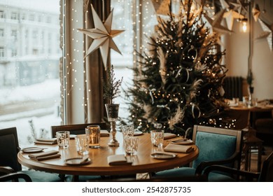 A beautifully set dining table in a cozy restaurant, adorned with holiday decorations, a sparkling Christmas tree, and star ornaments. Snowy window view creates a warm festive ambiance - Powered by Shutterstock