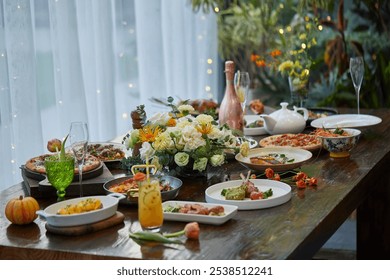 A beautifully set dining table with floral centerpiece, assorted dishes, a pink champagne bottle, and a bright orange drink near sheer curtains. - Powered by Shutterstock