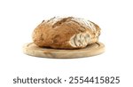 A beautifully sliced artisan bread loaf is displayed on a wooden cutting board. The bread is dusted with flour, showcasing its rustic texture and fresh, homemade appearance.