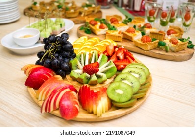 Beautifully Sliced Fruit, A Snack Of Sliced Fresh Ripe Fruit On A Wooden Round Tray