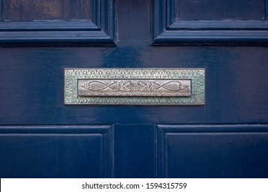 Beautifully Worked Mailbox Or Letter Box On A Dark Blue Wooden Front Door