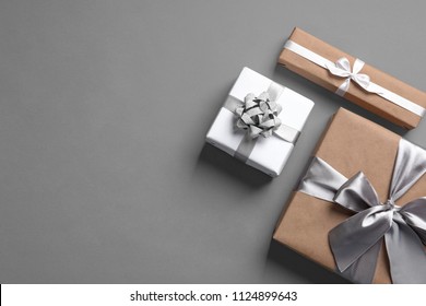 Beautifully Wrapped Gift Boxes On Grey Background, Top View